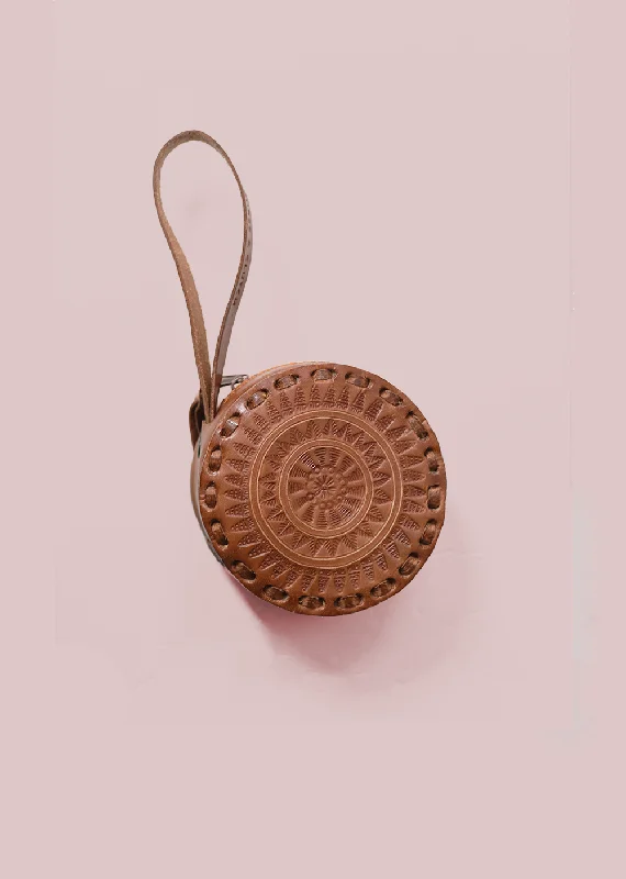 hats with built-in headphone holdersEmbossed Circle Wristlet in Brown